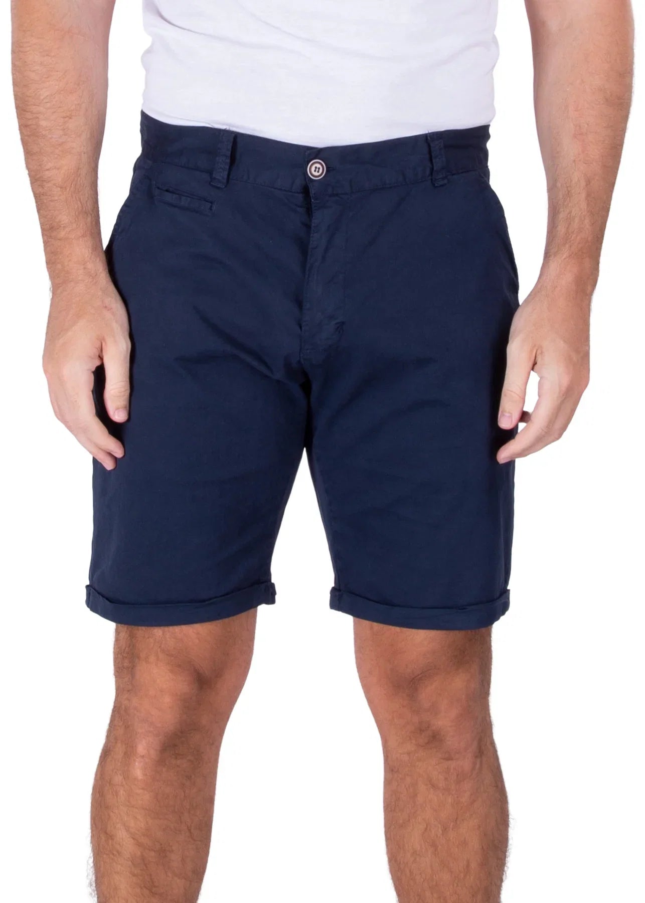 A man wearing dark navy blue Bespoke Essential Cotton Shorts with cuffed hems and a white t-shirt.