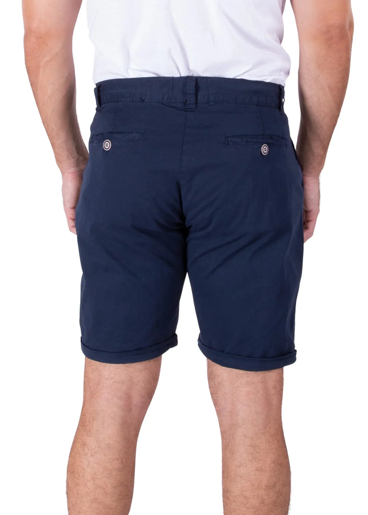 Rear view of a man wearing solid dark blue Bespoke cotton shorts and a white t-shirt against a plain white background.