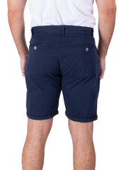 Rear view of a man wearing solid dark blue Bespoke cotton shorts and a white t-shirt against a plain white background.