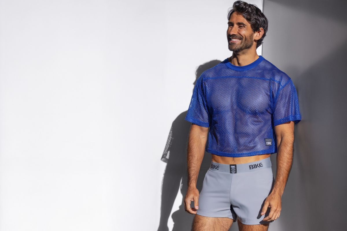 Blue mesh crop top with subtle texture and a small black logo on lower left side in royal BAM134 practice jersey