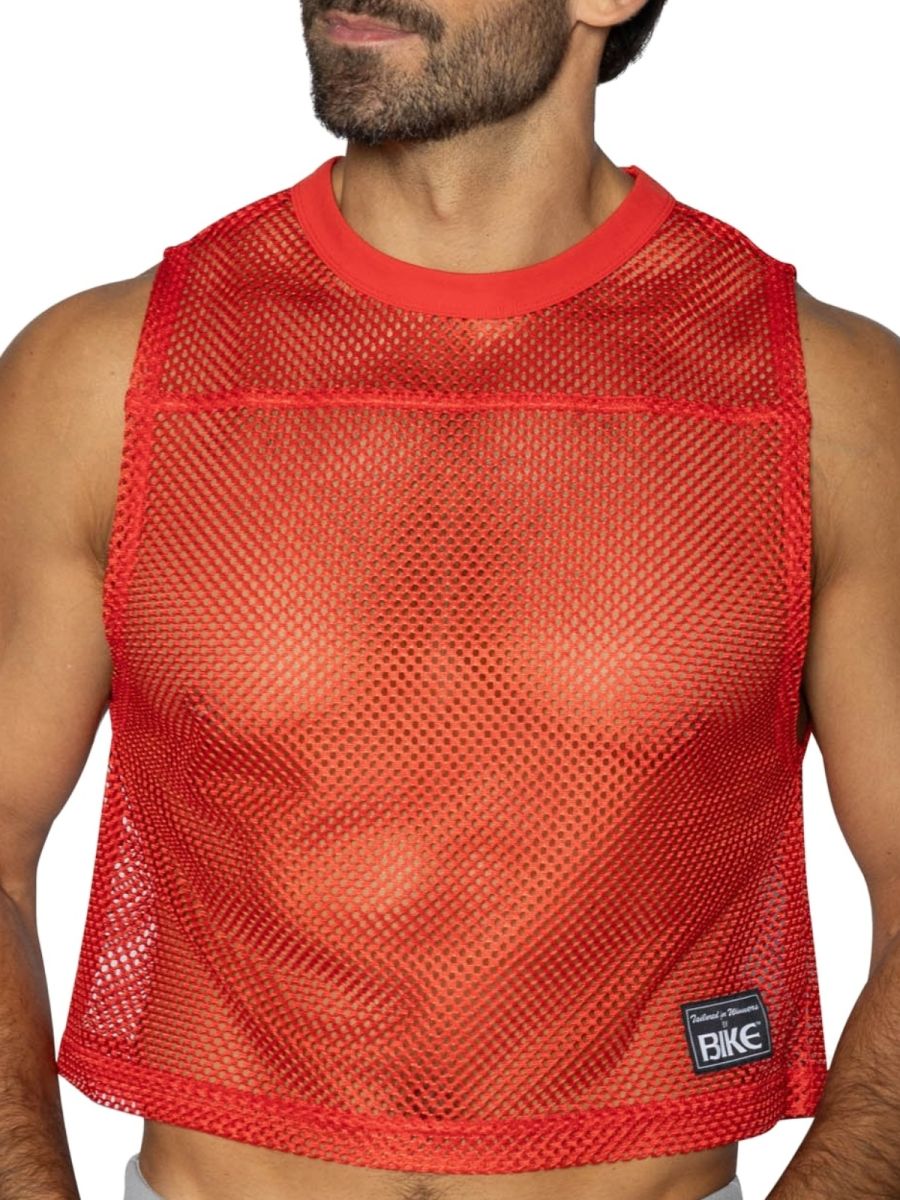 Red mesh crop top with solid red ribbed neckline and hem featuring small black bike brand patch lower right side