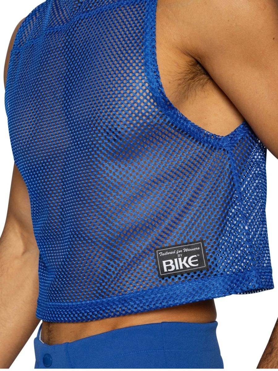 Back view of blue mesh crop top with black bike brand patch on lower back in vibrant royal blue color royal