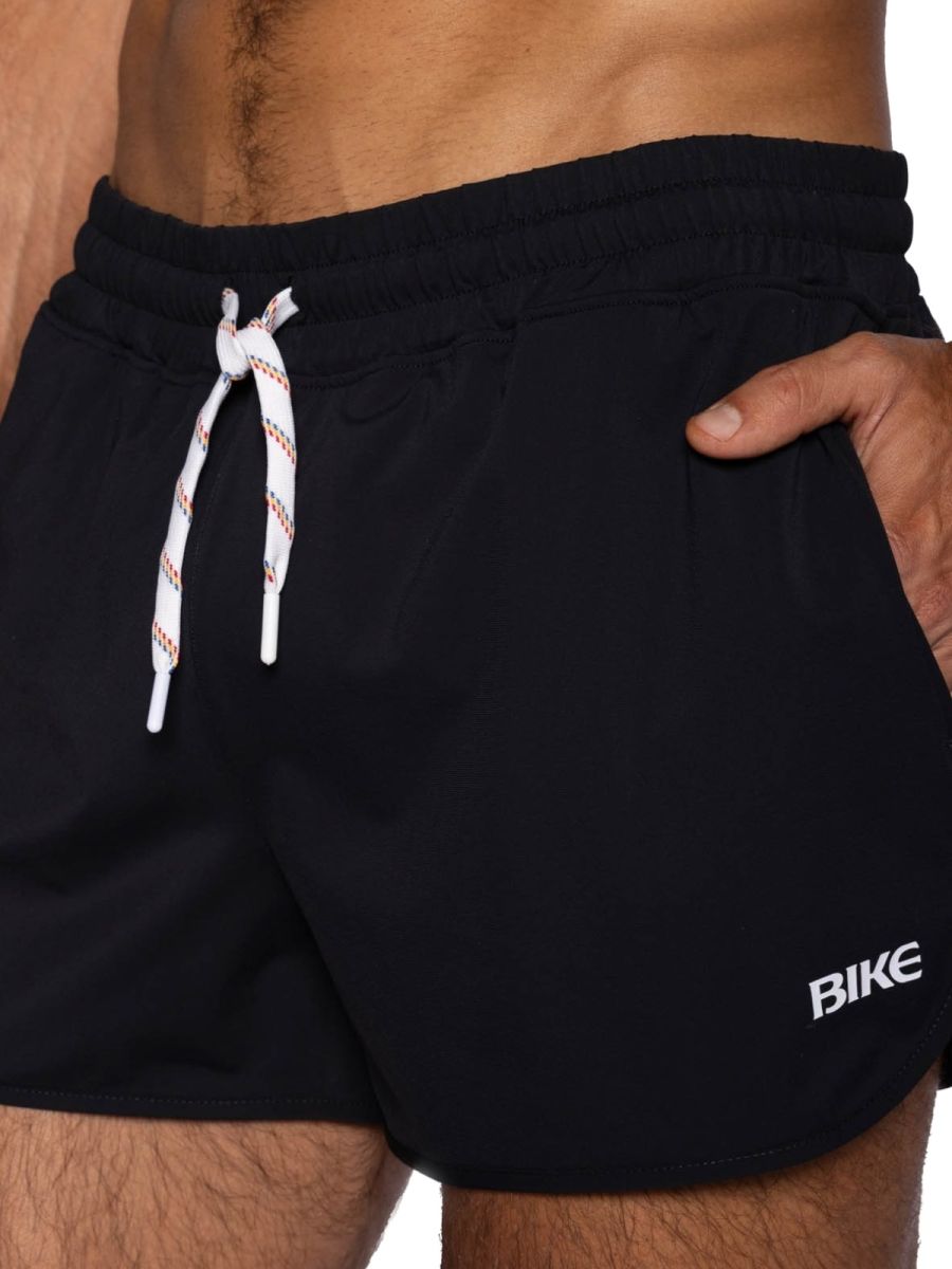 Black bike athletic bam200 track shorts with white and red striped drawstrings and small bike logo on the side