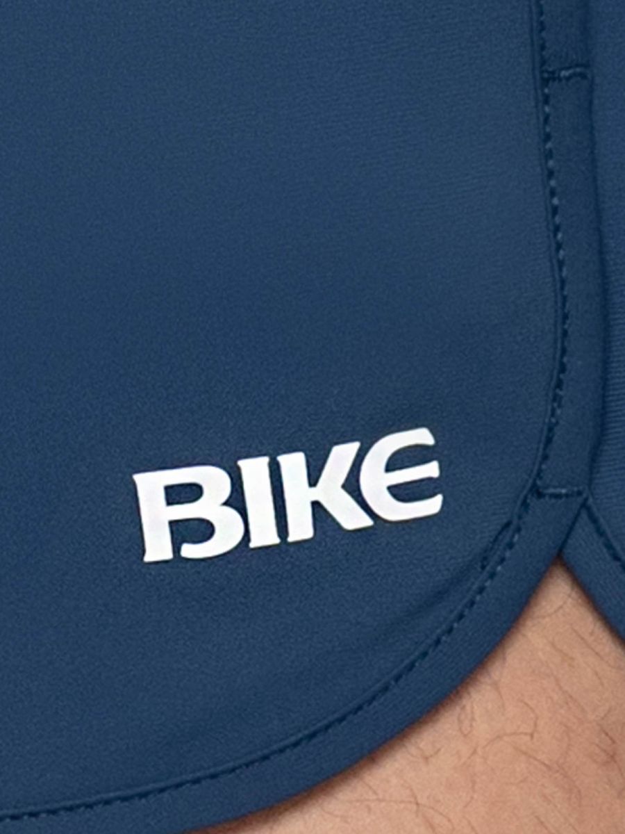 Navy blue bike athletic bam200 track shorts with white bike logo embroidered on the side for sports use