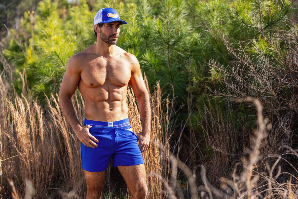Blue athletic shorts with matching waistband and small white logo on left side from bike bas306 original number 10 jockstrap in royal