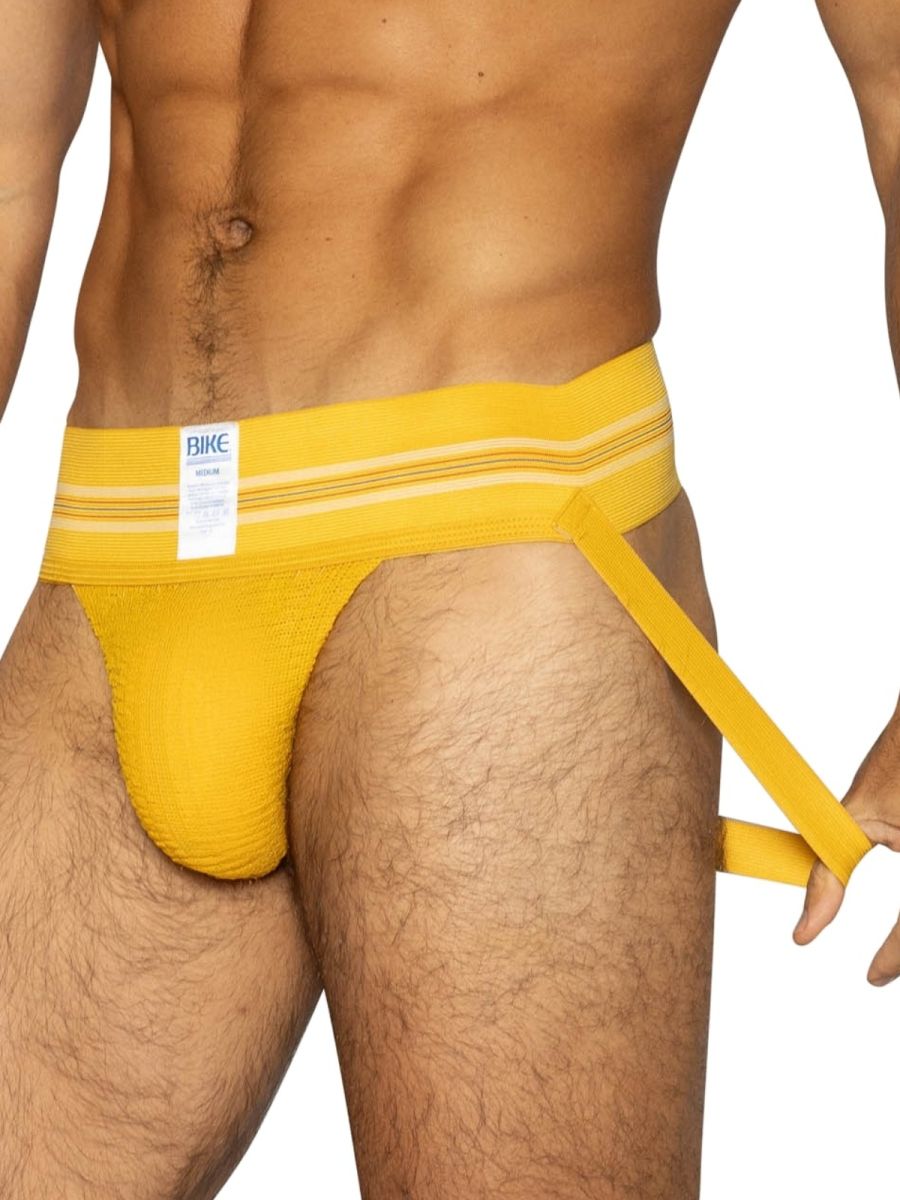 Bright yellow textured fabric bike brief with white bike label on waistband from BIKE Athletic BAS306 jockstrap series