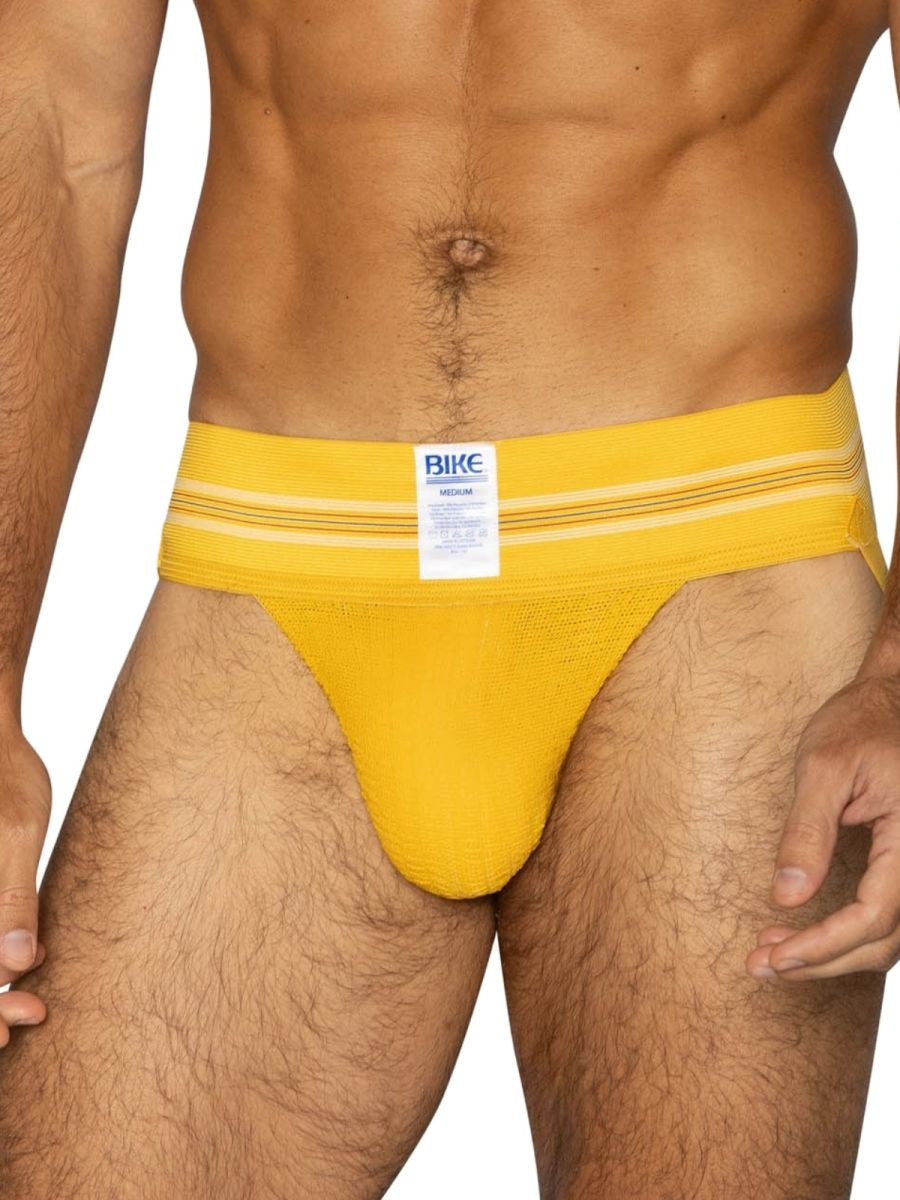Bright yellow textured fabric bike brief with white stripes and bike brand label in the original number 10 style