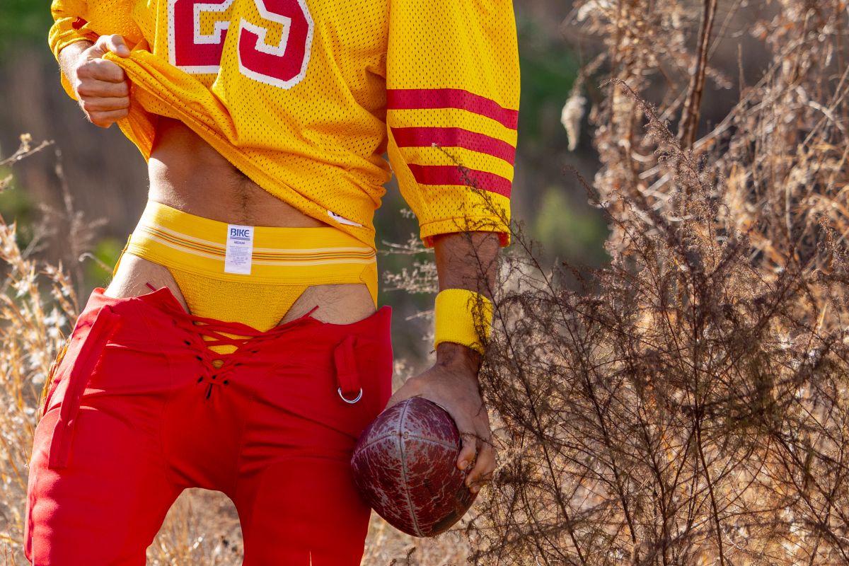 Yellow mesh football jersey with red and white number 23 on the chest from bike athletic in yellow color