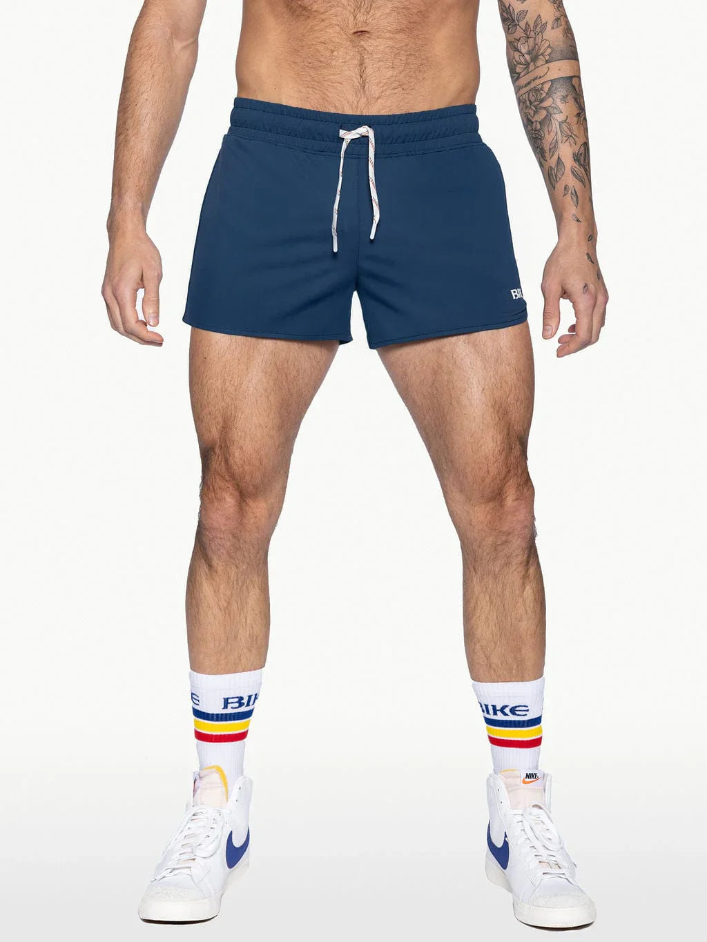 Navy blue bike track short with white drawstrings and a small logo on the lower right leg for athletic wear