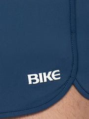 Dark blue bike track short with white bike logo embroidered on the side ideal for athletic use