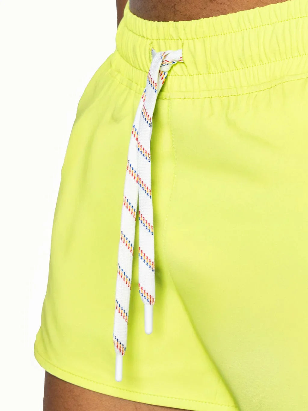 Bright neon yellow bike track short with white drawstring and colorful diagonal stripes for athletic use