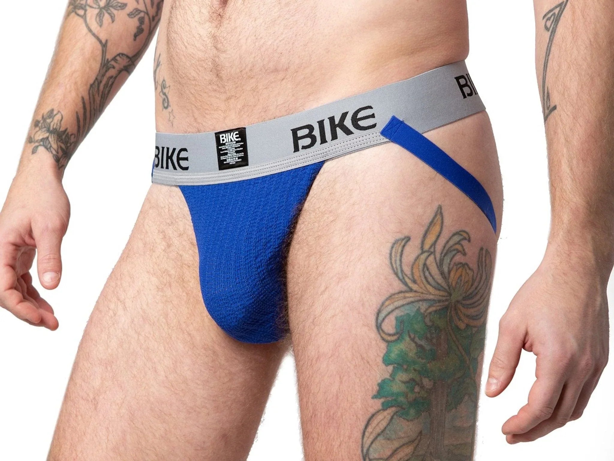 Blue bike classic jockstrap with gray waistband featuring black lettering showing the front side of the product