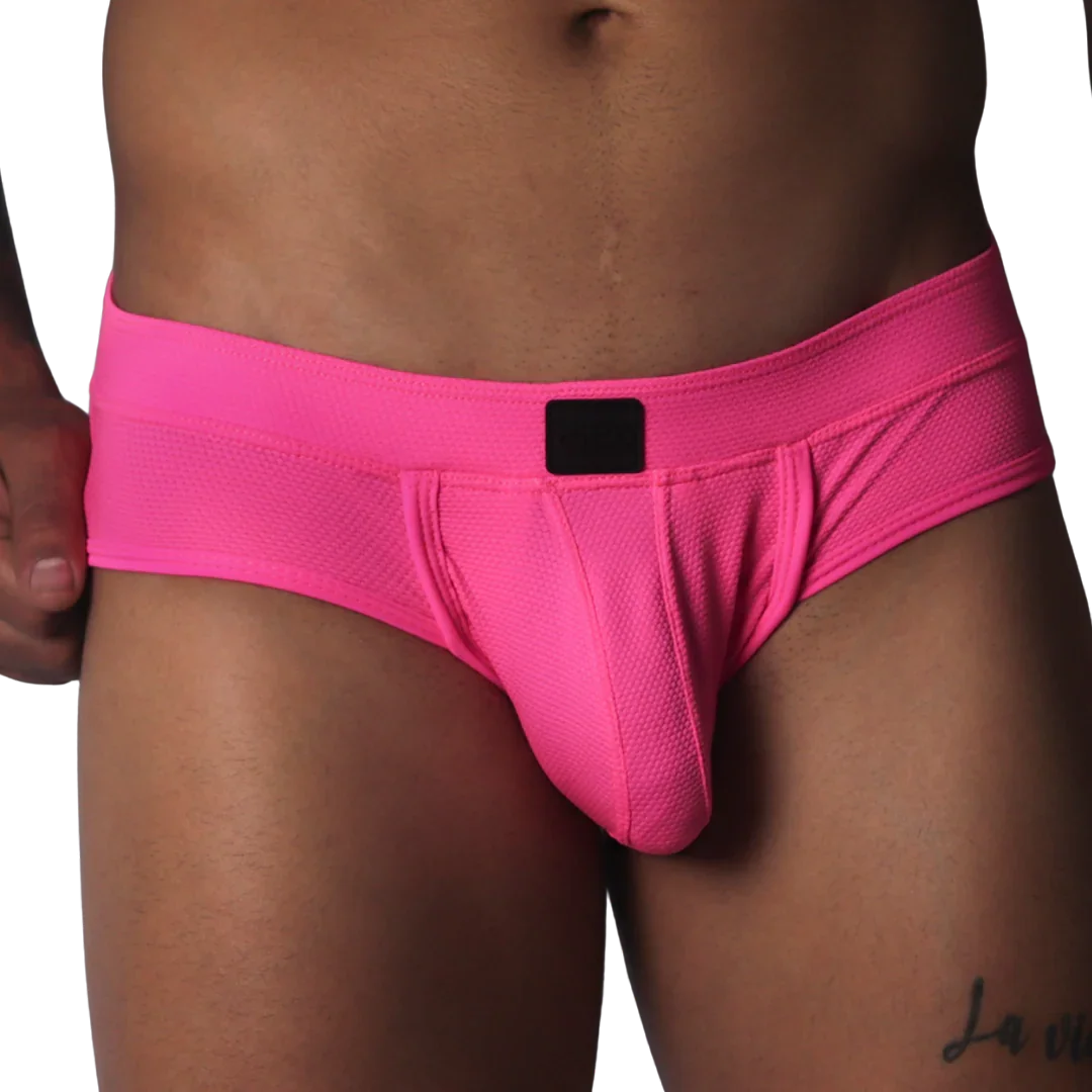Fuchsia-colored low-rise briefs in textured mesh fabric with a centered black logo patch on the waistband.
