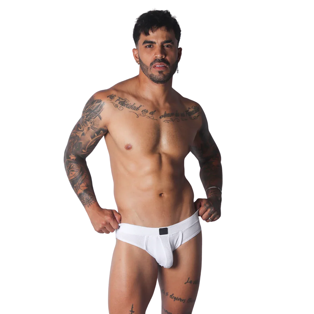 White textured athletic jockstrap with a central black logo tag on the waistband, worn by a muscular man.