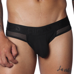 Black jockstrap with a branded elastic waistband, sheer mesh side panels, and a contour pouch.