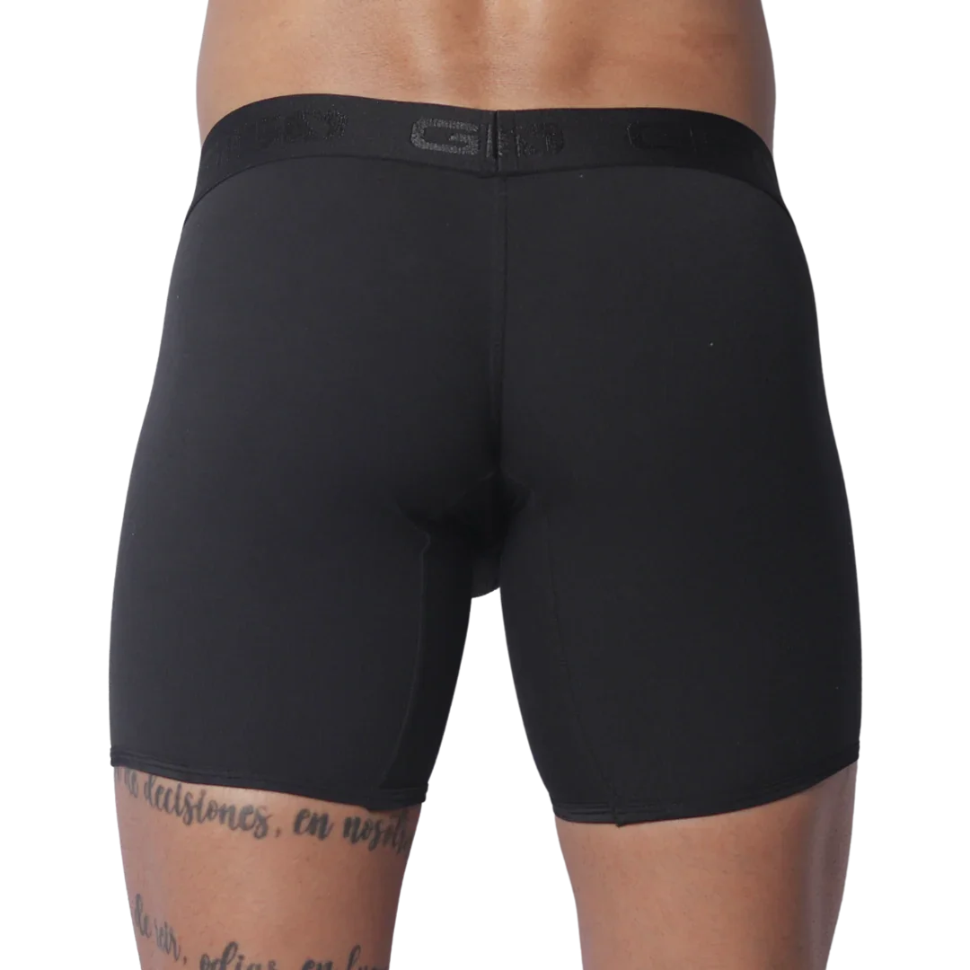 Solid black fitted boxer trunks with a wide, tonal branded elastic waistband.