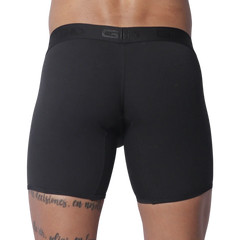 Solid black fitted boxer trunks with a wide, tonal branded elastic waistband.