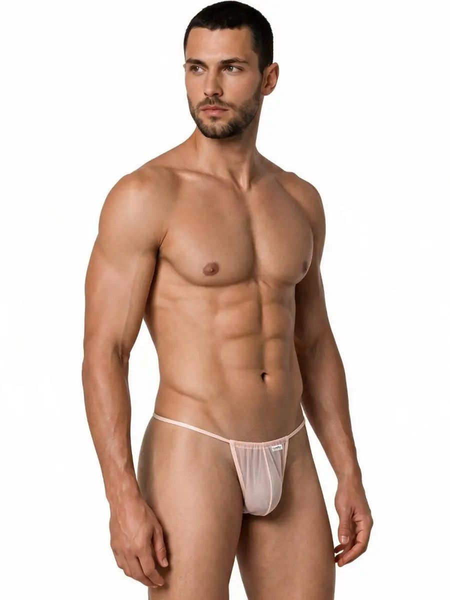 Male model wearing CandyMan sheer light peach mini G-string underwear with thin waistband and front pouch