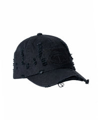 Black distressed cotton baseball cap with frayed edges and embroidered patch detail by Nasty Pig