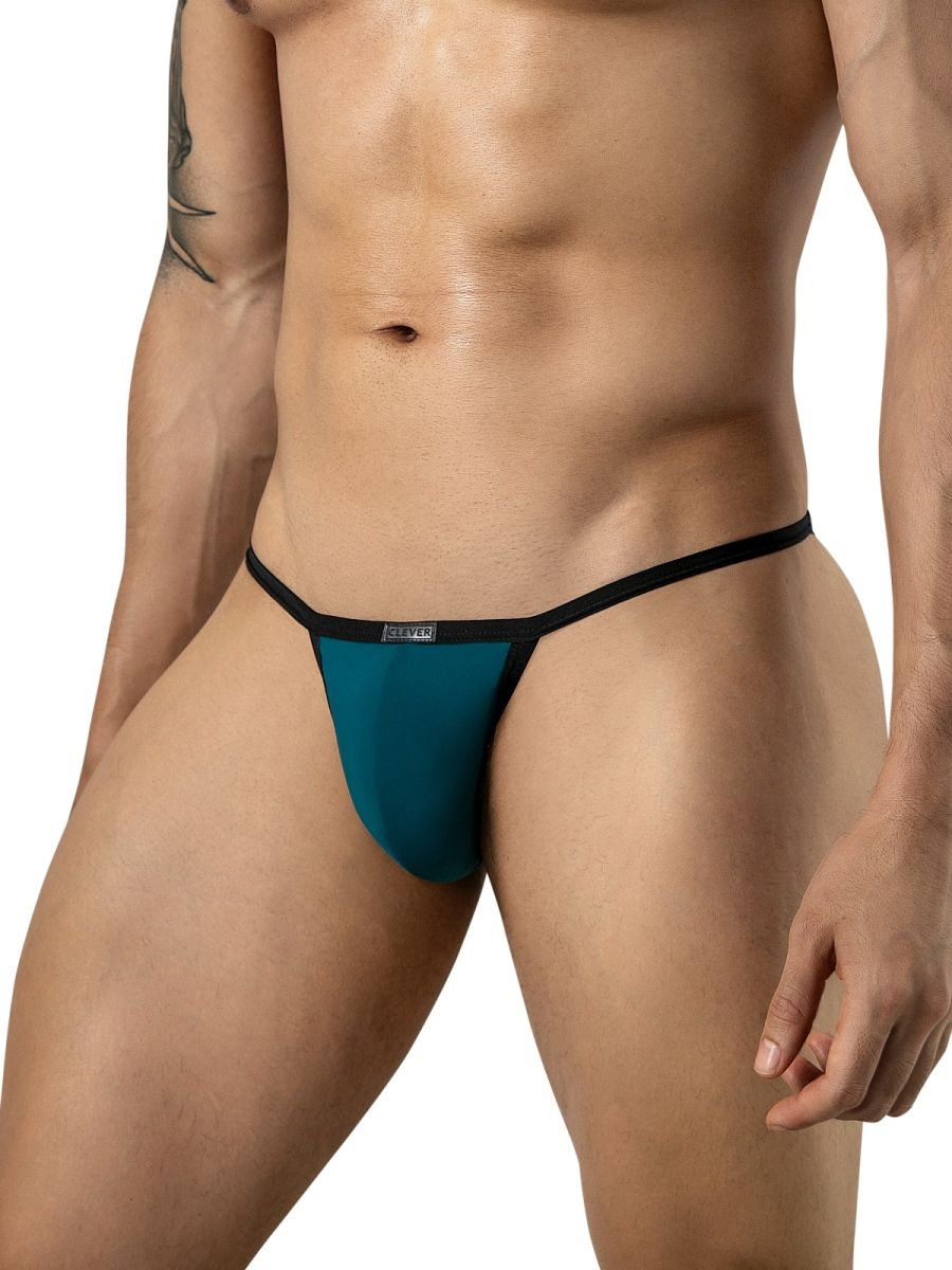 Clever Moda petrol blue briefs with black trim and thin side straps on a model.