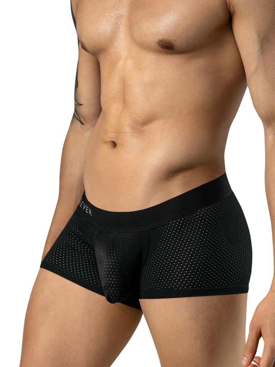 Black mesh low-rise trunks with a supportive contoured pouch and branded elastic waistband worn by a man.