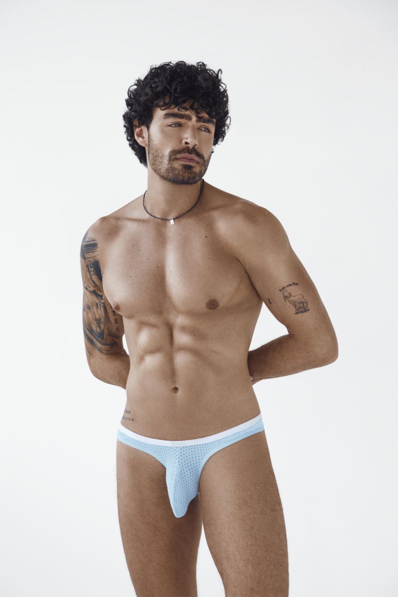 Clever Moda light blue Ulises briefs with dotted pattern worn by a male model with hands behind his back.