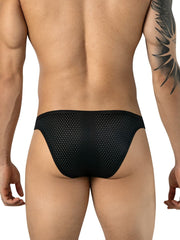 Rear view of a man wearing black mesh briefs with a patterned tattoo on his right arm.