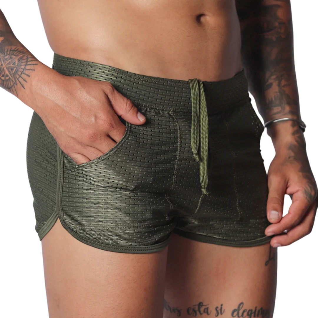 Olive green mesh athletic shorts with a drawstring waist, side pockets, and a short-cut curved hem.