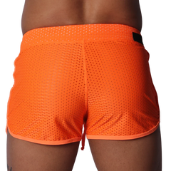 Bright orange athletic mesh shorts with a thick waistband and contrasting orange hem trim.
