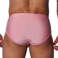 Solid pink athletic swim briefs featuring a classic brief cut with stitched panels and a supportive waistband.