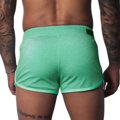 Flash green, shimmering athletic-style shorts with contrast trim and a rear waistband tab.
