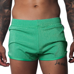 Flash green, form-fitting glittery athletic shorts with a clean hem and elastic waistband.
