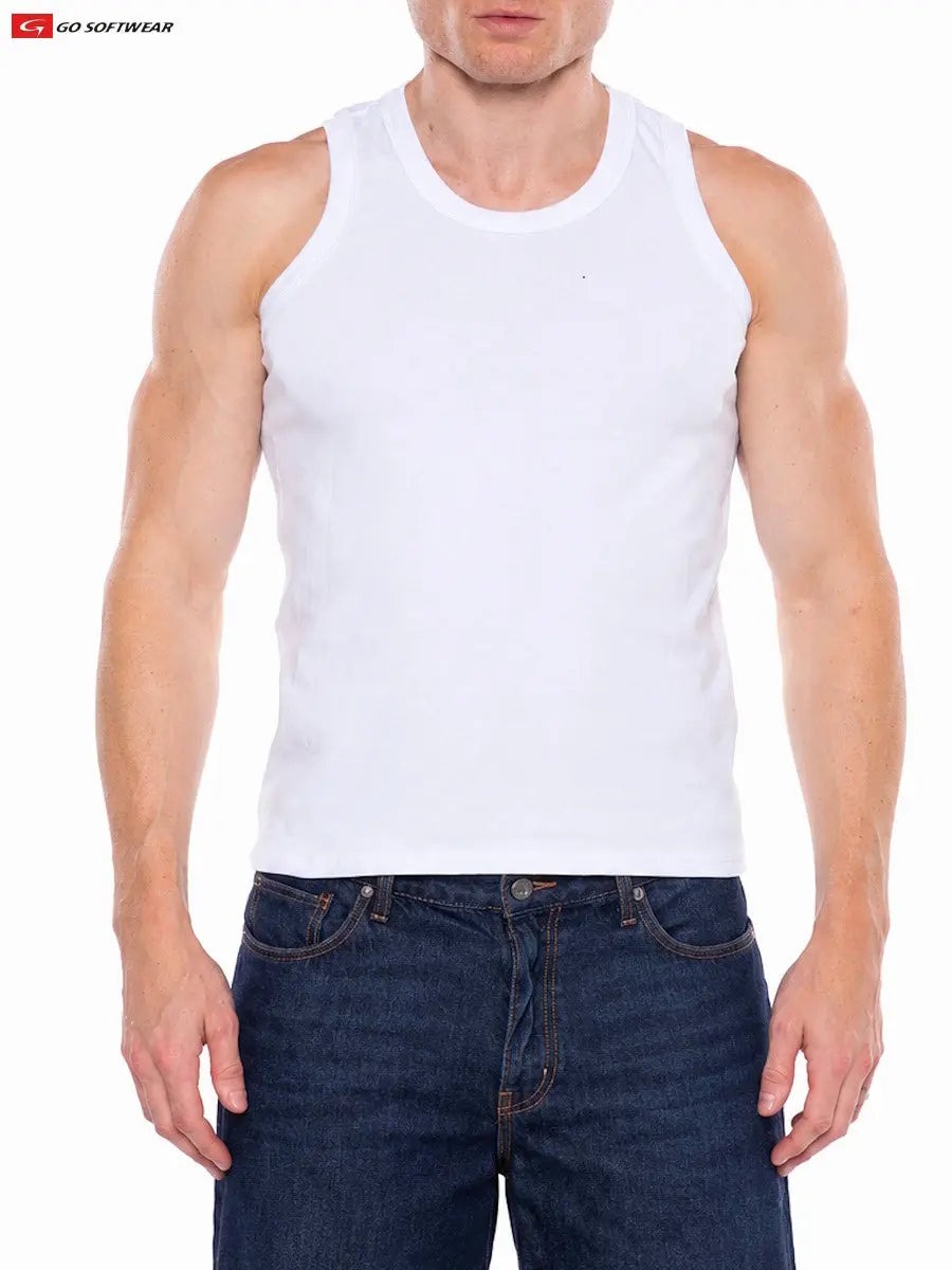 Man wearing a white fitted sleeveless tank top paired with dark blue jeans by Go Softwear