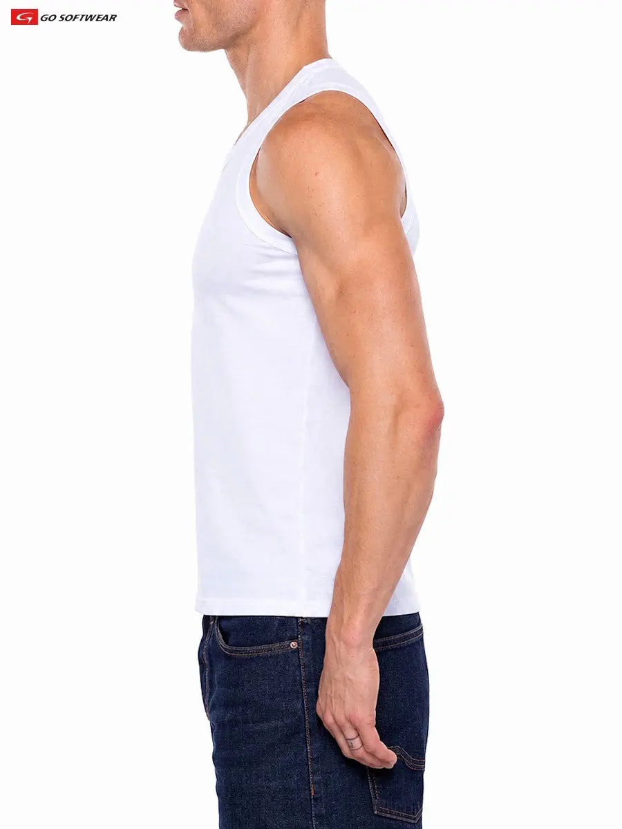 Side view of a man wearing a white sleeveless body fit tank top paired with dark blue jeans by Go Softwear