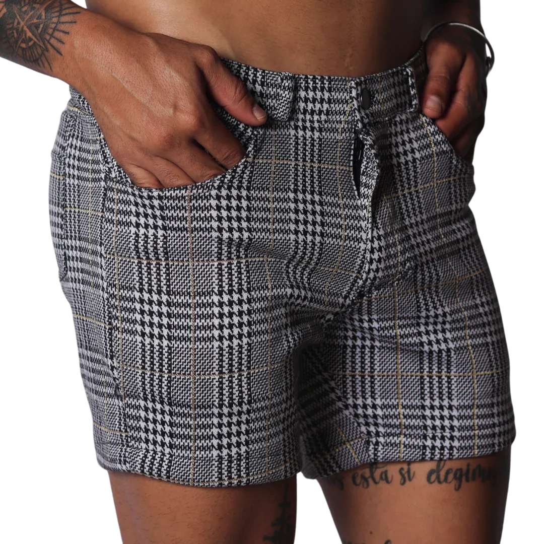 Men's slim-fit shorts in a black and white houndstooth glen plaid pattern with subtle gold thread accents.