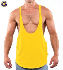 Muscular man wearing a gold yellow string tank top with deep scoop neck and thin straps by AMERICAN JOCK