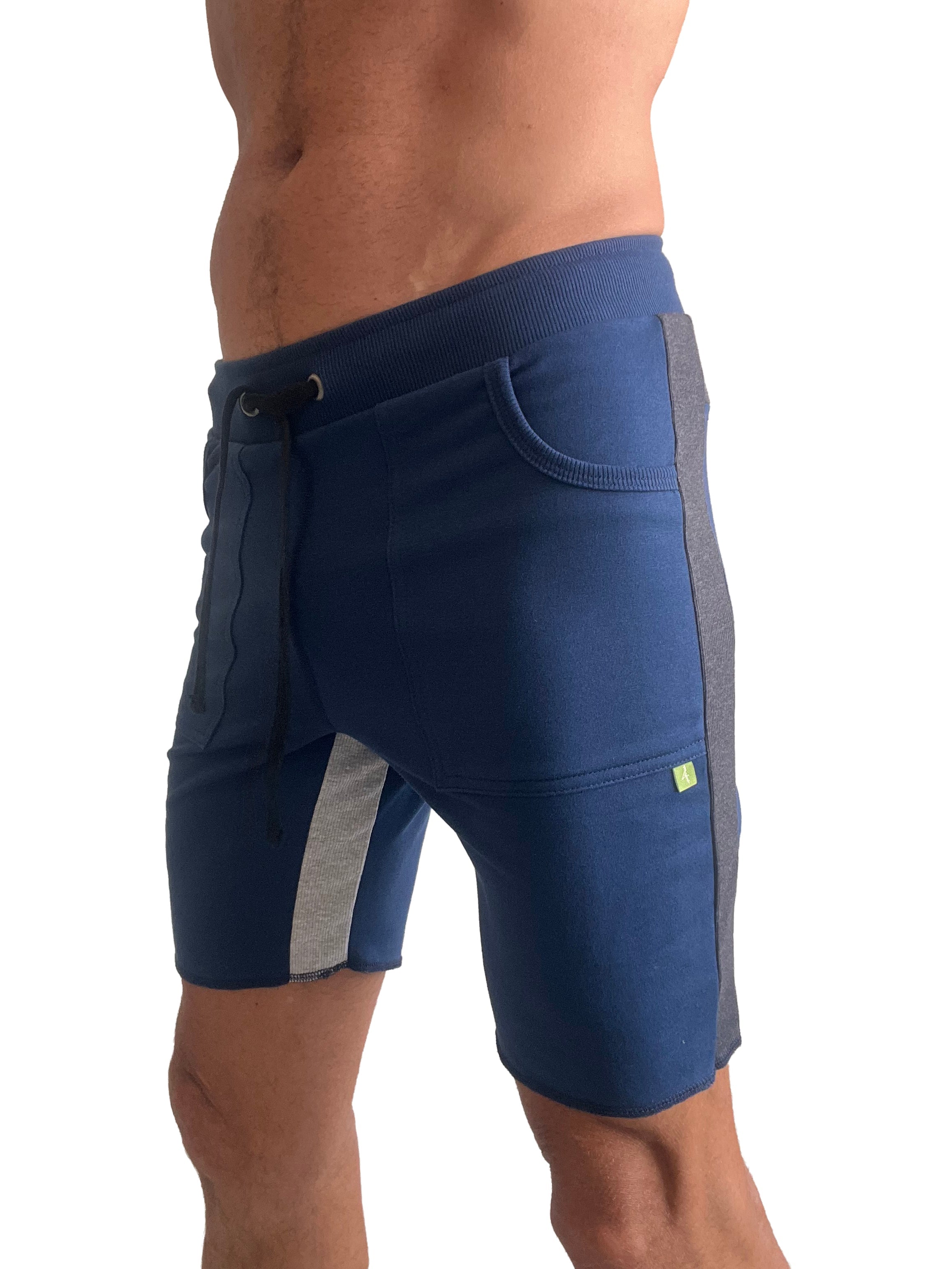 Tri-color ultra-flex yoga track short in navy blue with gray side panels and green logo designed for athletic use