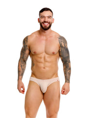 Beige jor 2348 invisible bikini briefs with a subtle red logo on the waistband designed for athletic use