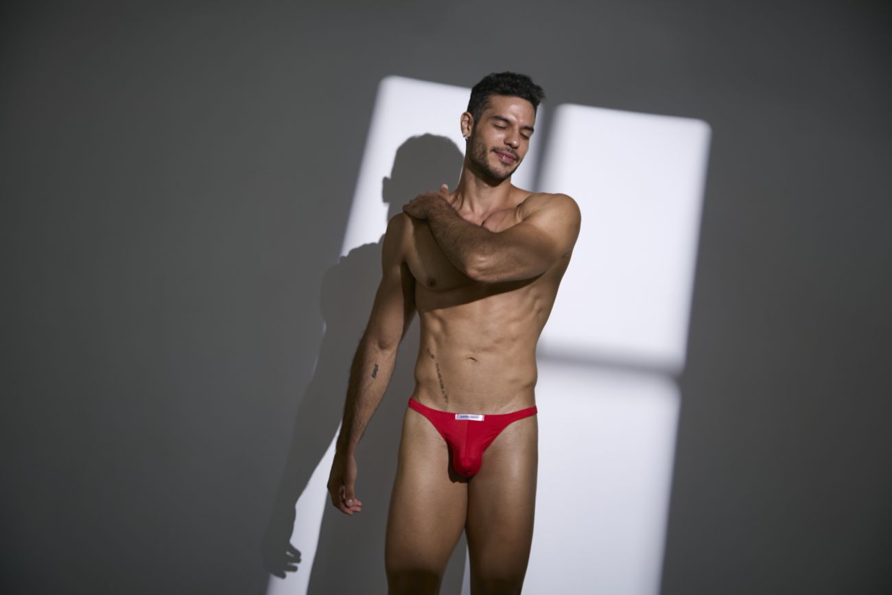Justin+Simon XSJ03 classic thongs in peach red with a white logo on the waistband showing the back side