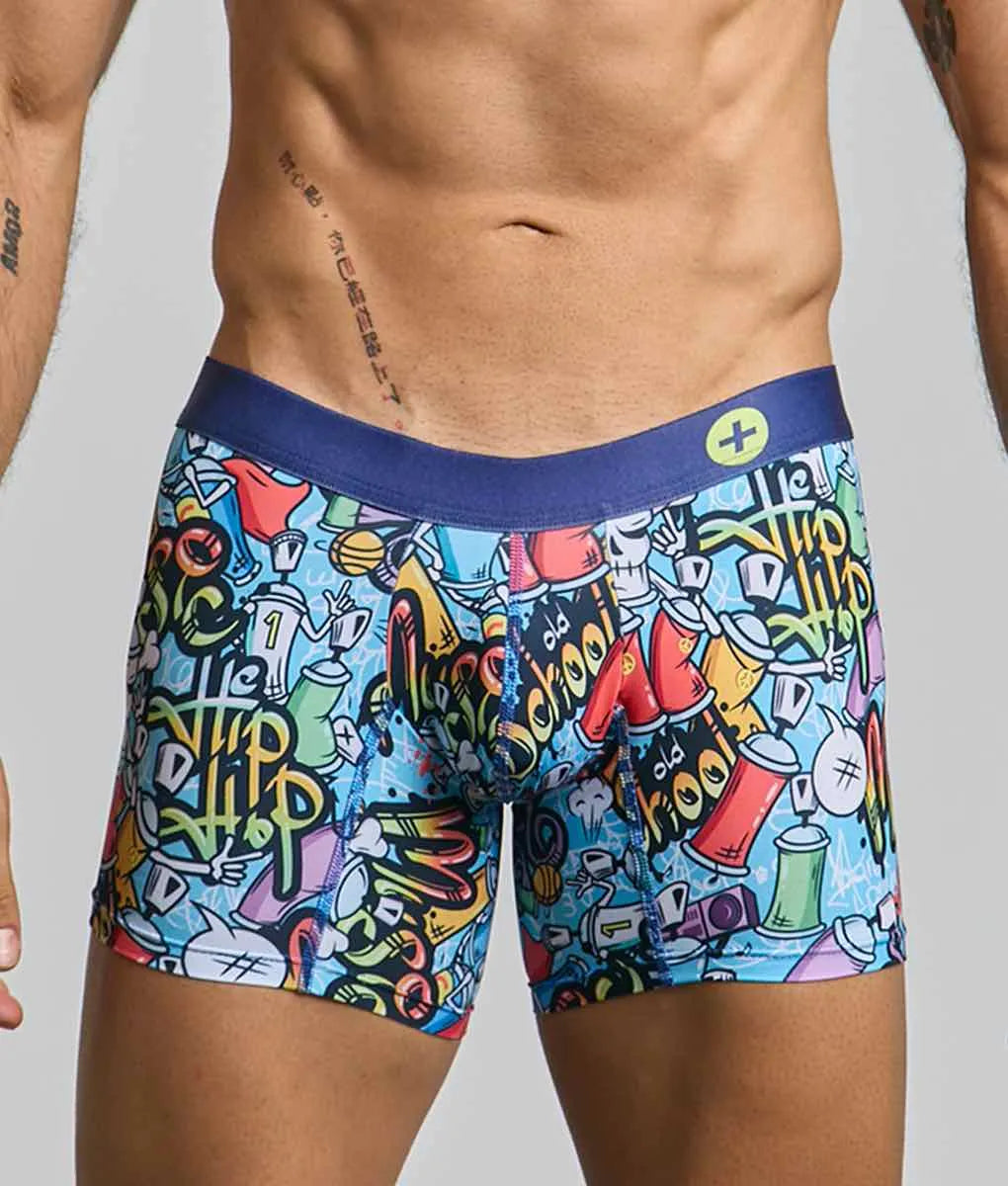 Malebasics boxer brief hipster featuring vibrant graffiti design with spray paint cans skulls and hip hop lettering on light blue