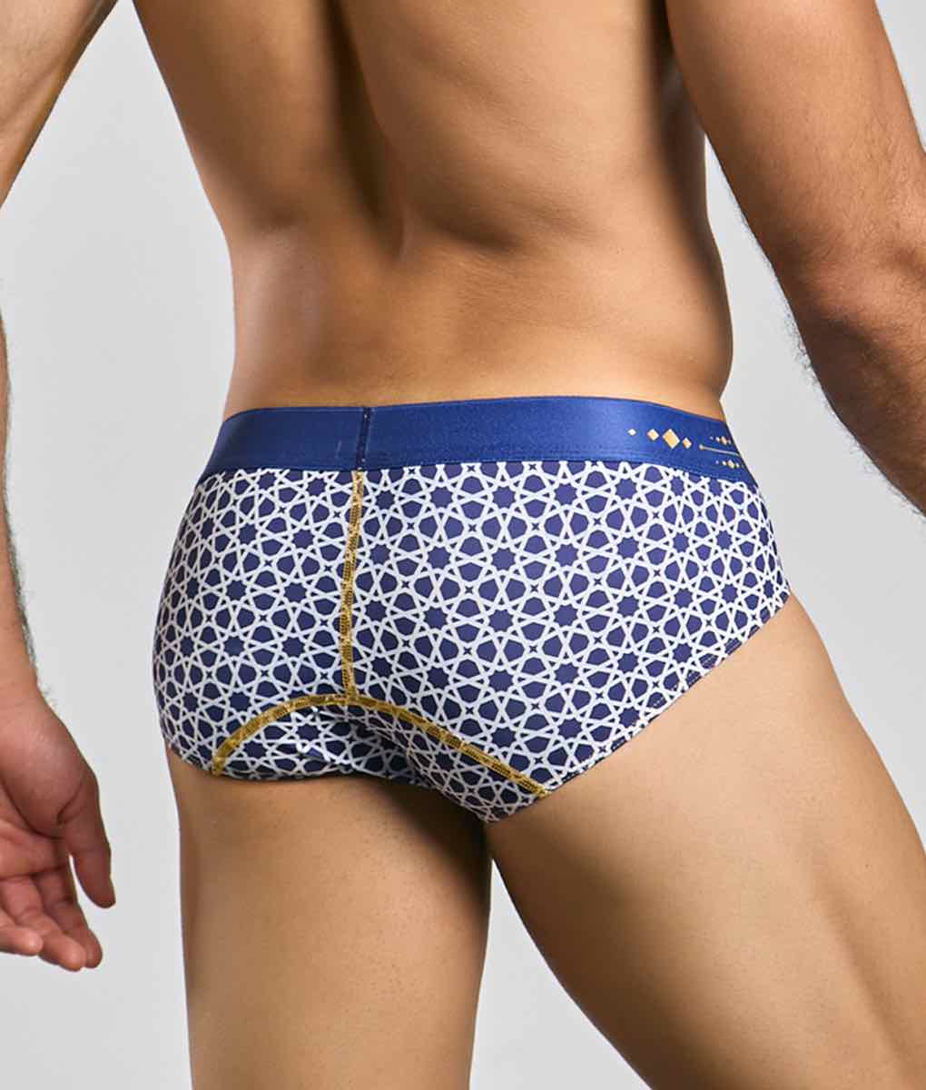 Malebasics hipster brief featuring blue and white patterned fabric with gold trim for stylish comfort