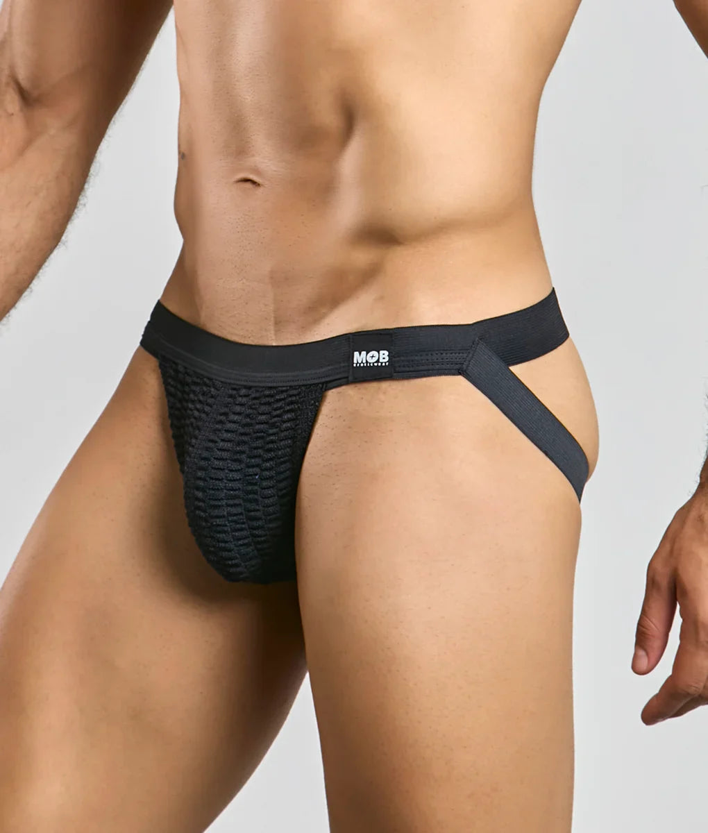 Black mesh mob swim jockstrap briefs with supportive elastic waistband and side straps featuring the mob logo