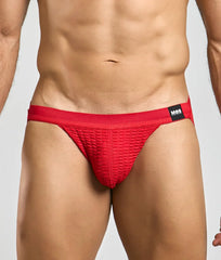 Red textured briefs with a black mob brand tag on the waistband from the mob swim jockstrap collection