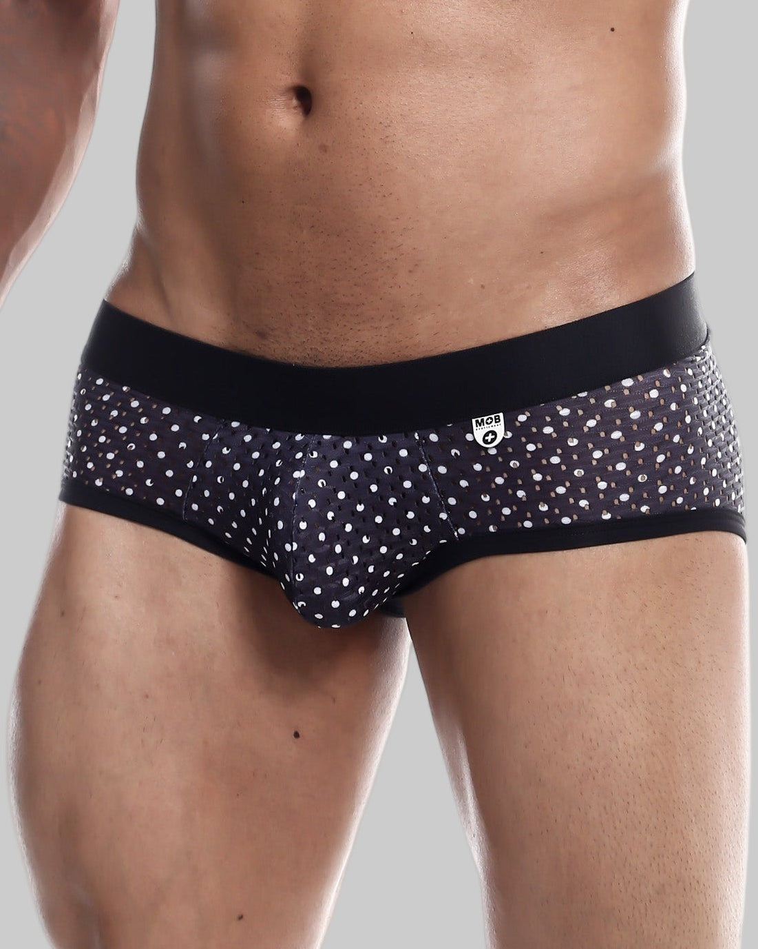 Black and white polka dot men’s briefs with black elastic waistband from mob aero brief final sale collection