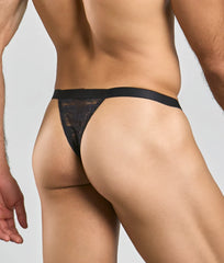 Black lace thong with solid waistband by MOB Y featuring delicate lace material and minimal coverage for sexy appeal