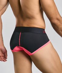 Black athletic briefs with vibrant pink trim mesh detailing and subtle brand logo on the waistband malebasics neon brief