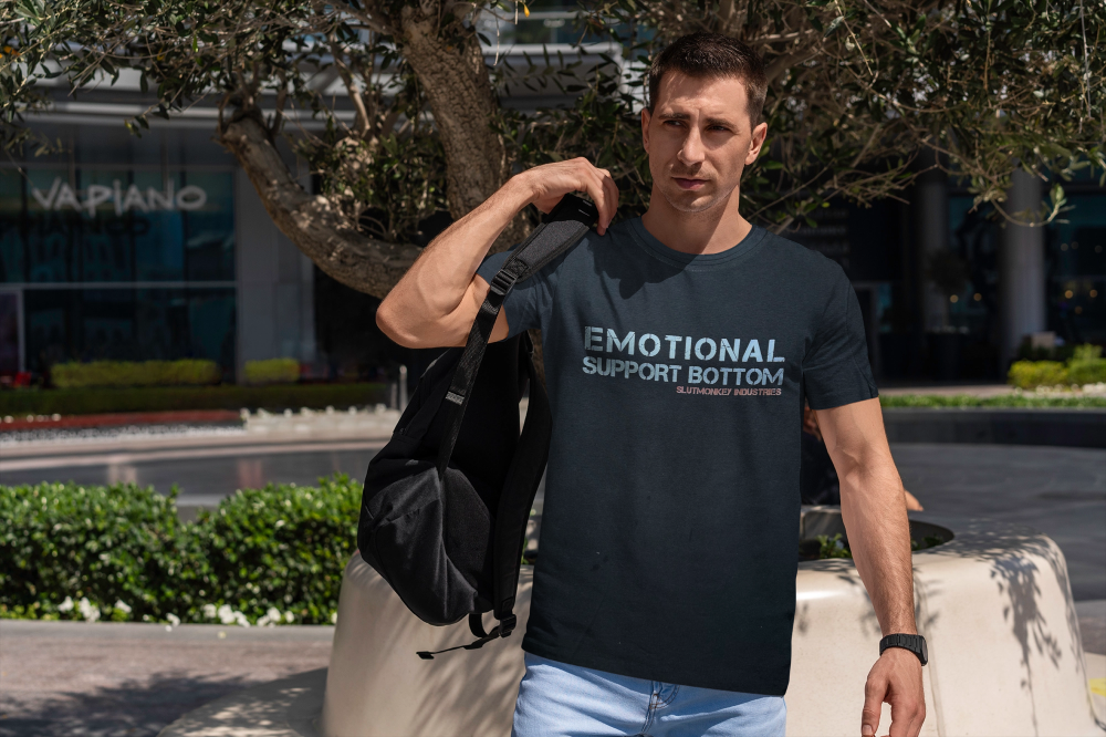 Dark navy blue short-sleeved t-shirt with white emotional support bottom text and smaller red text below