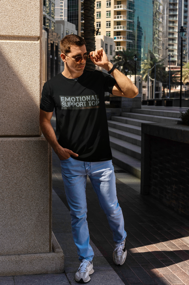 Black short-sleeved cotton t-shirt with emotional support top printed in white and gray text across the chest