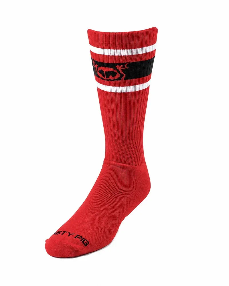 Red ribbed crew sock with black and white stripes and logo band near top black brand name on toe by Nasty Pig
