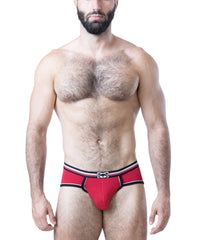 Male model wearing red cotton briefs with black and white trim and logo waistband by Nasty Pig